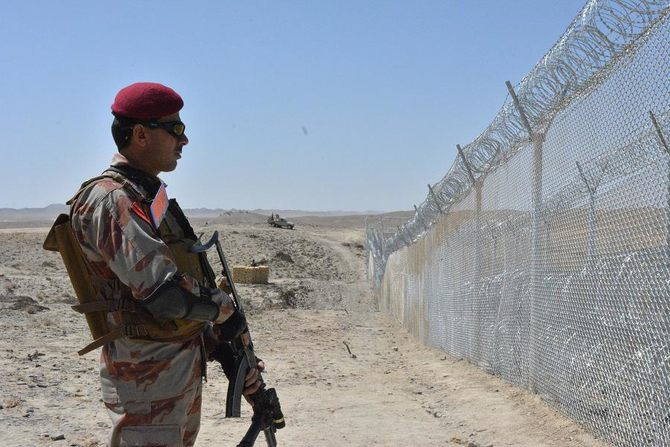 A Pakistani army soldier stands guard along with border fence at the Pak-Afghan border near the Punjpai area of Quetta in Balochistan on May 8, 2018. (AFP/ File)