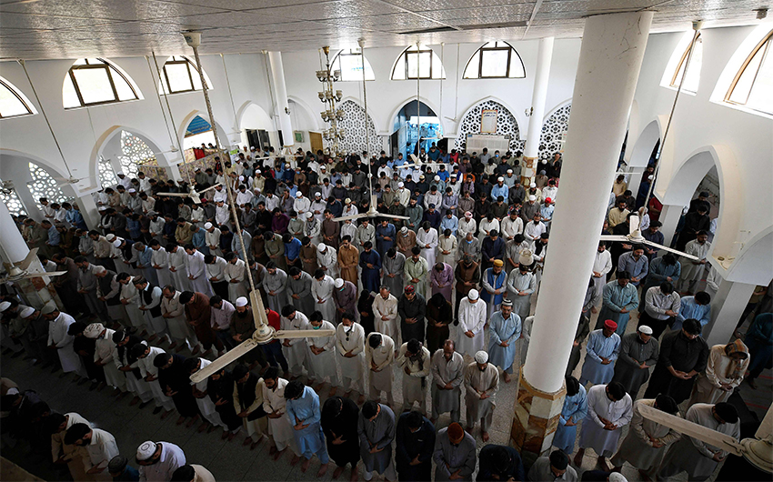 Devotees offer 'Taraweeh' evening prayer at the Markazi Jamia mosque during Muslim's holy month of Ramadan in Rawalpindi, Pakistan, amid the coronavirus pandemic on May 5, 2021. (AFP)