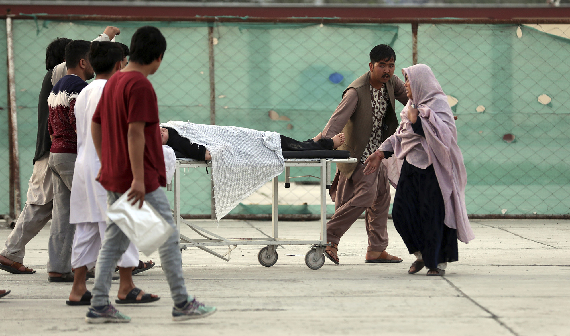 An injured school student is transported to a hospital after a bomb explosion near a school west of Kabul, Afghanistan on May 8, 2021. (AP)