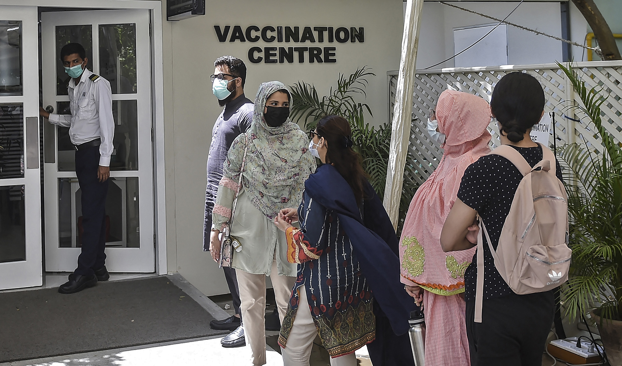 People wait for their turn to receive a dose of the Russia's Sputnik V vaccine against the Covid-19 coronavirus at a vaccination centre in Karachi, Pakistan on April 5, 2021. (AFP/File)