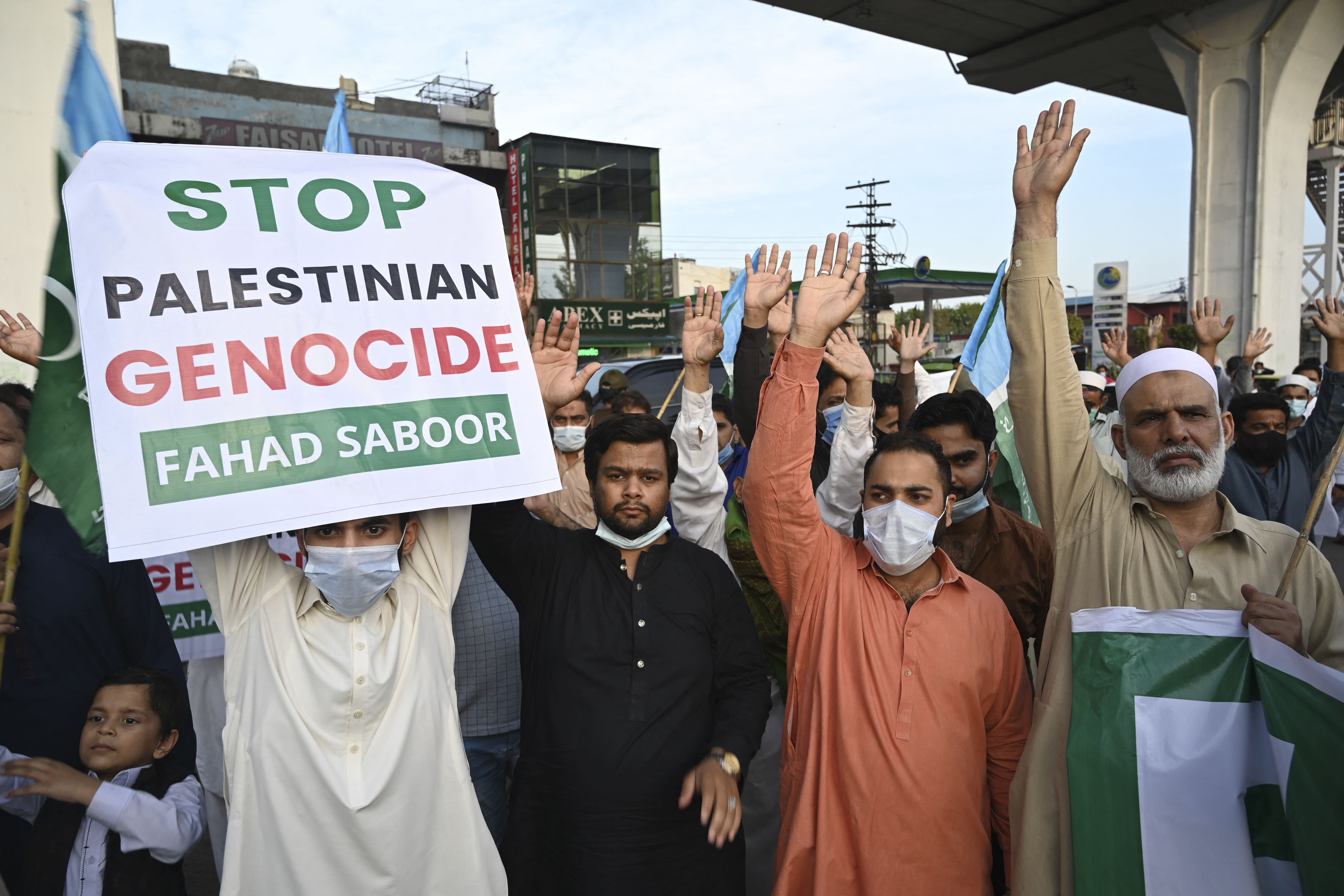 Activists of Jamaat-e-Islami (JI) shout slogans in Rawalpindi on May 11, 2021. (AFP)