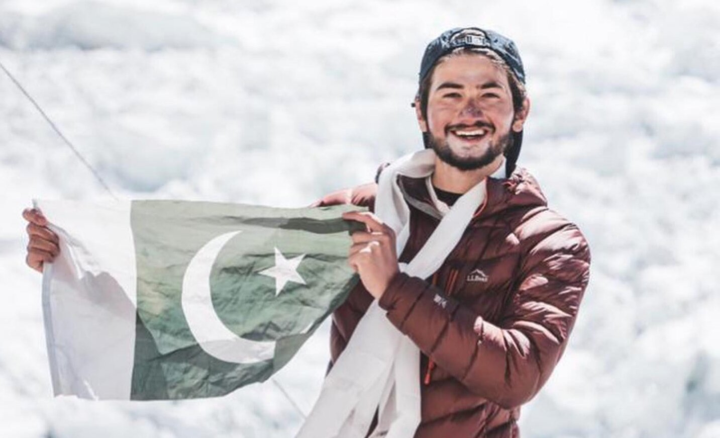 In this undated photo, Shehroze Kashif, a 19-year-old climber from Lahore, is seen holding a flag of Pakistan. (Photo courtesy: Alpine Adventure Guides)