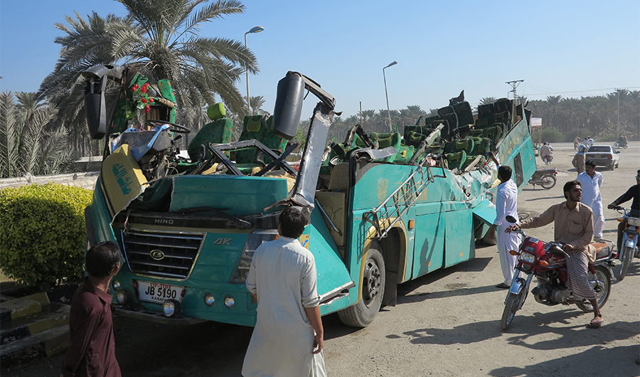 File photo of a Pakistani passenger bus with its roof ripped off the main body is pictured after the accident in Khairpur area off Karachi, on November 11, 2014. (AFP)