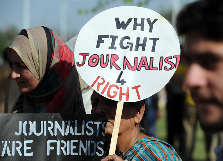 Pakistani journalists hold placards during a protest in Islamabad on April 23, 2014. (AFP)