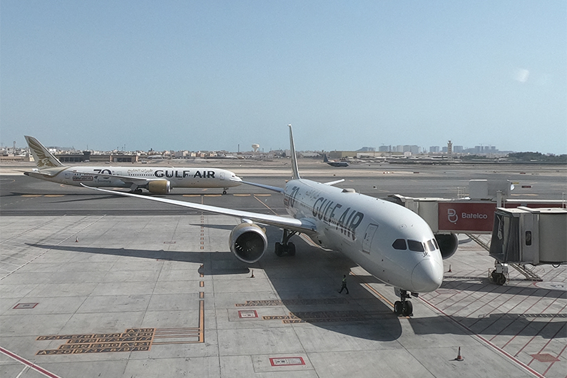 Gulf Air Boeing B787-900 aircrafts are seen from the new passenger terminal of Bahrain International Airport, south of the Bahraini capital Manama, on March 29, 2021. (AFP)