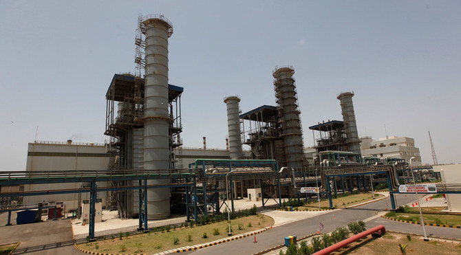 A worker walks at the Bin Qasim Power Station (BQPS-II), some 35 kilometers (22 miles) from east of Karachi, on June 20, 2013. (Reuters/File)