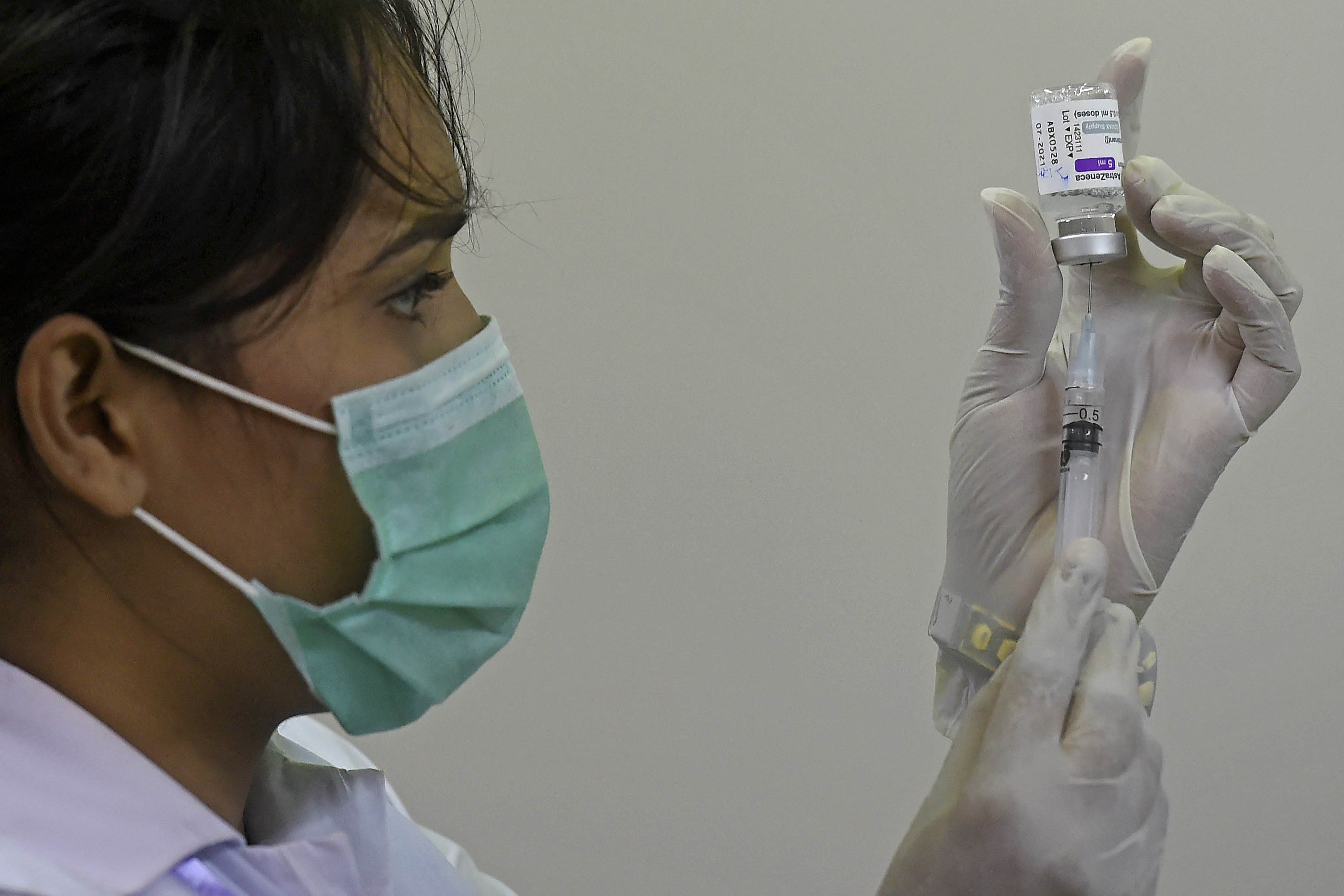 A health worker prepares a dose of the Covishield AstraZeneca-Oxford's Covid-19 coronavirus vaccine at a vaccination centre in Karachi on May 12, 2021. (AFP)
