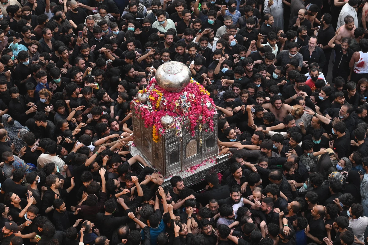 Shiite Muslim devotees take part in a procession to commemorate the death anniversary of Prophet Mohammad's companion and son-in-law Imam Ali in Lahore on May 4, 2021. (AFP)