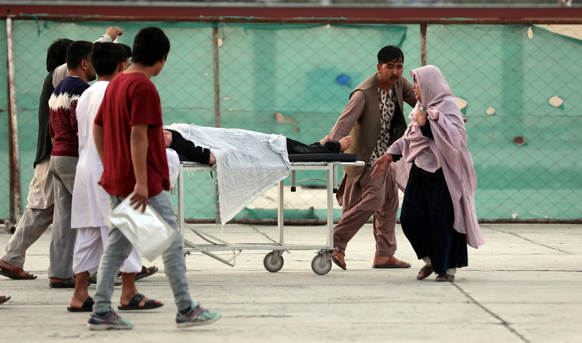 An injured school student is transported to a hospital after a bomb explosion near a school west of Kabul, Afghanistan on May 8, 2021. (AP)