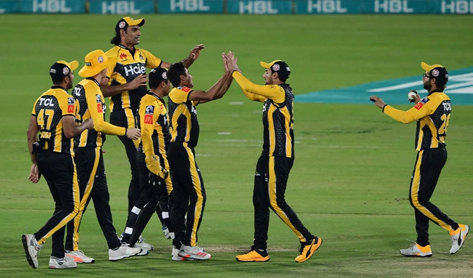 Peshawar Zalmi's players celebrate after the dismissal of Quetta Gladiators' Cameron Delport during the PSL T20 cricket match between Peshawar Zalmi and Quetta Gladiators at the National Stadium in Karachi on February 26, 2021. (AFP)
