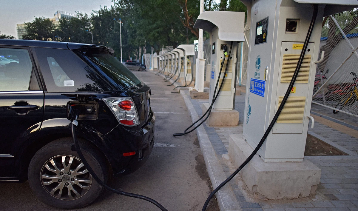 A BYD electric car charges at a charging station in Beijing, China, on September 11, 2017. (AFP/File)