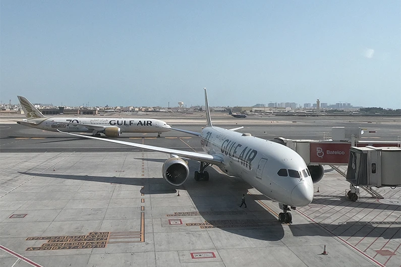 Gulf Air Boeing B787-900 aircrafts are seen from the new passenger terminal of Bahrain International Airport, south of the Bahraini capital Manama, on March 29, 2021. (AFP)
