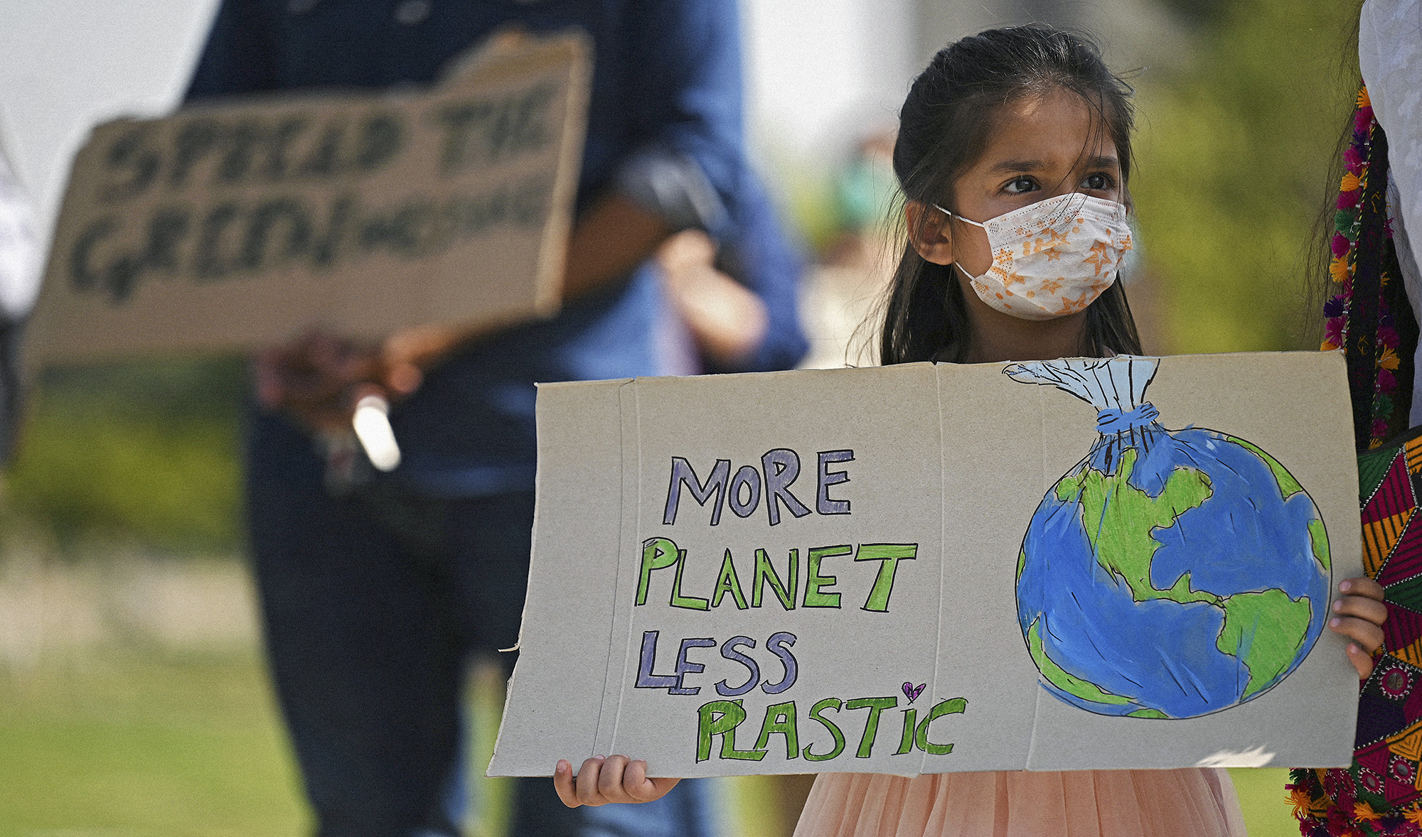 Climate activists hold placards as they take part in a demonstration in support of the environmental and climate protection movement 'Fridays for Future' in Islamabad on March 19, 2021. (AFP/File)