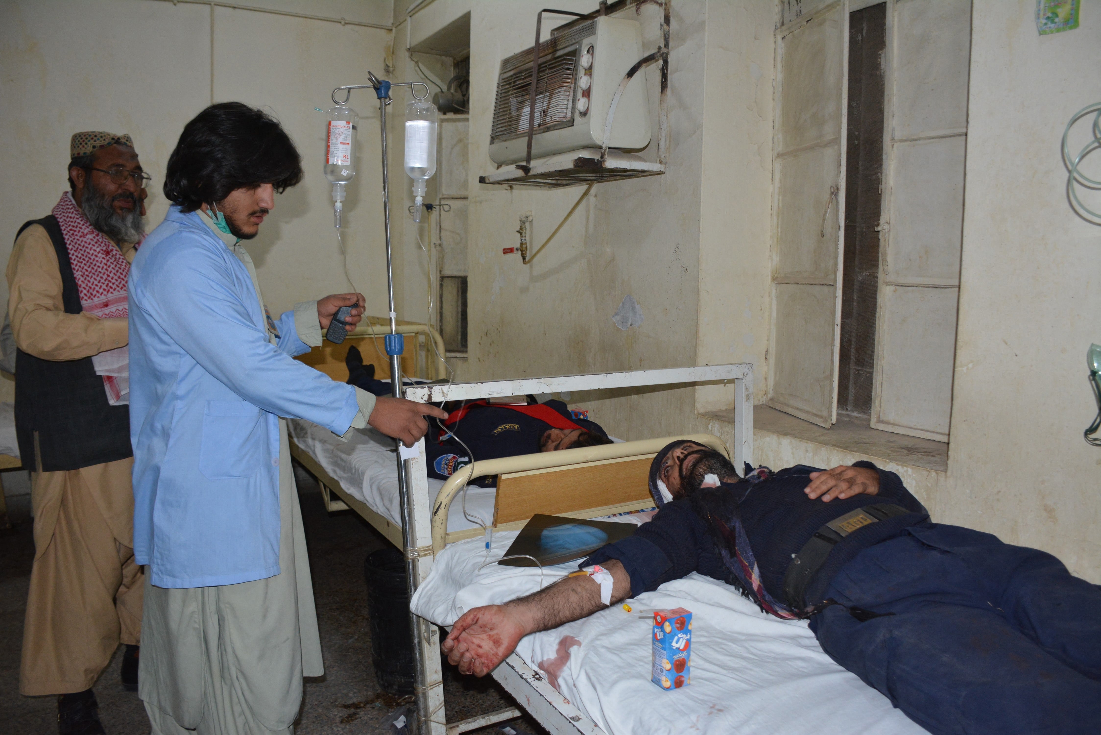 A paramedic provides medical care to an injured victim at a hospital in Quetta, Pakistan, on April 21, 2021. (AFP)