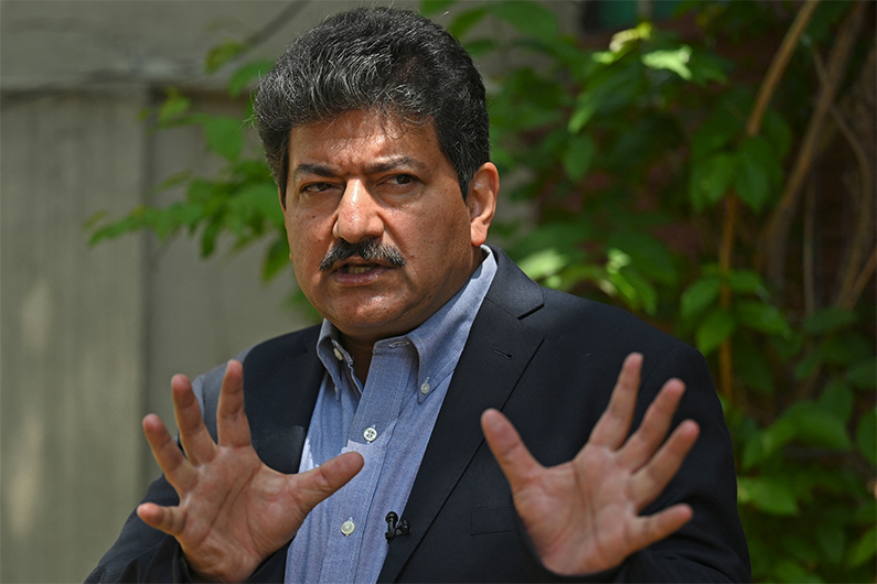 Pakistani prominent journalist Hamid Mir speaks with AFP during an interview in Islamabad on April 27, 2021. (AFP)