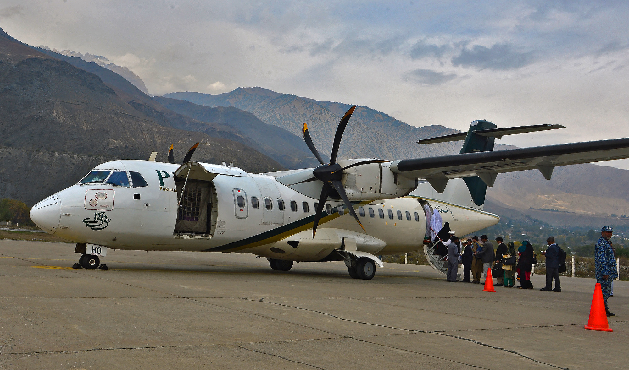 In this file picture taken on November 1, 2015, passengers of Pakistan International Airlines (PIA) wait to board an ATR plane for Islamabad, in Chitral, Pakistan. (AFP/File)