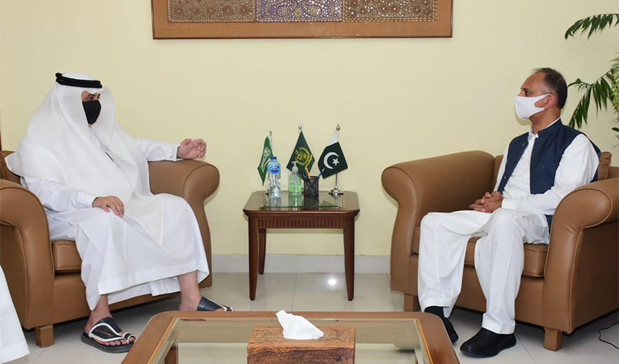 Saudi Arabia's ambassador to Pakistan Nawaf Al-Maliki (left) speaks to Pakistan's federal minister for economic affairs Omar Ayub Khan (right) in Islamabad on June 9, 2021. (Photo courtesy: KSA embassy twitter)