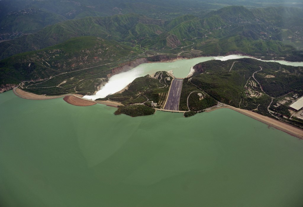 This aerial view shows water leaving the Tarbela Dam spillway in Tarbela, Khyber Pakhtunkhwa on August 24, 2010. (AFP/File)