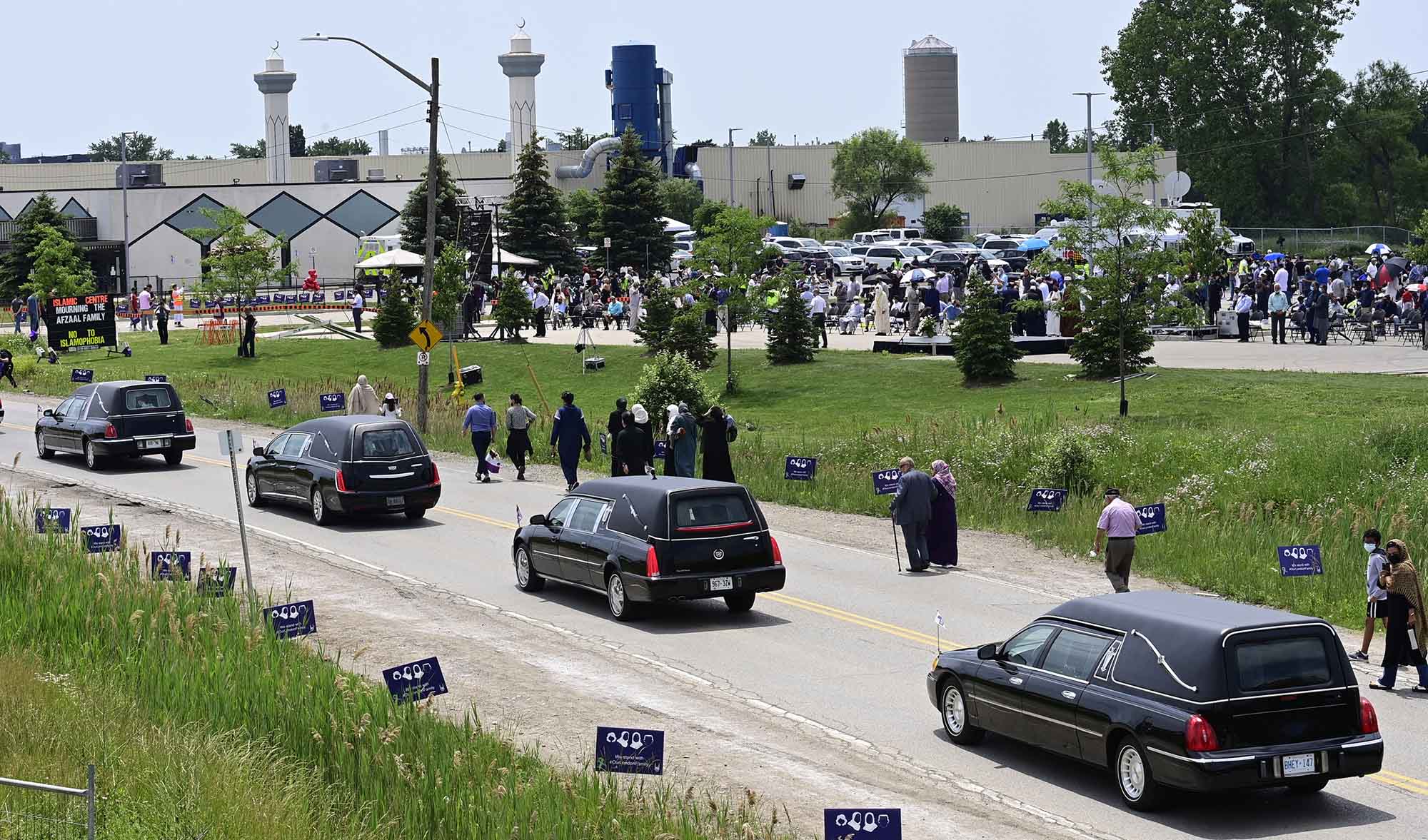 Four hearses arrive to funeral for the four Muslim family members killed in a deadly vehicle attack last week, in London, Ontario, on June 12, 2021. (The Canadian Press via AP)