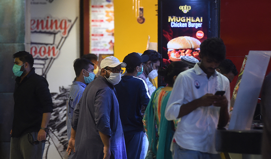People order food in a mall in Karachi on August 11, 2020. (AFP)