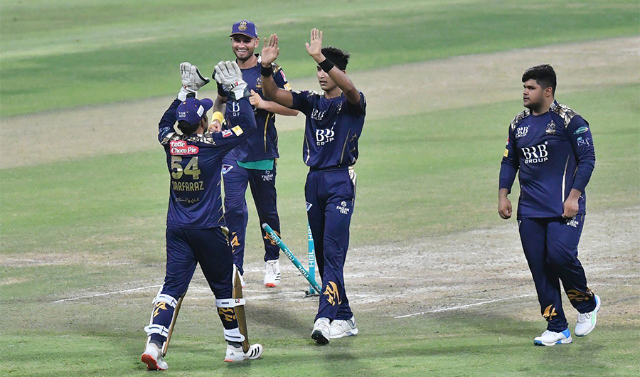 Pakistan Super League's team Quetta Galdiators players celebrate the dismissal of a Lahore Qalandar batsman in Abu Dhabi on June 15, 2021. (Photo courtesy: PSL Twitter)