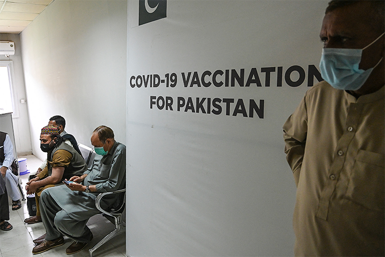 Senior citizens wait to receive a Chinese-made Sinopharm vaccine against the Covid-19 coronavirus, at a vaccination centre in Islamabad on March 10, 2021. (AFP)