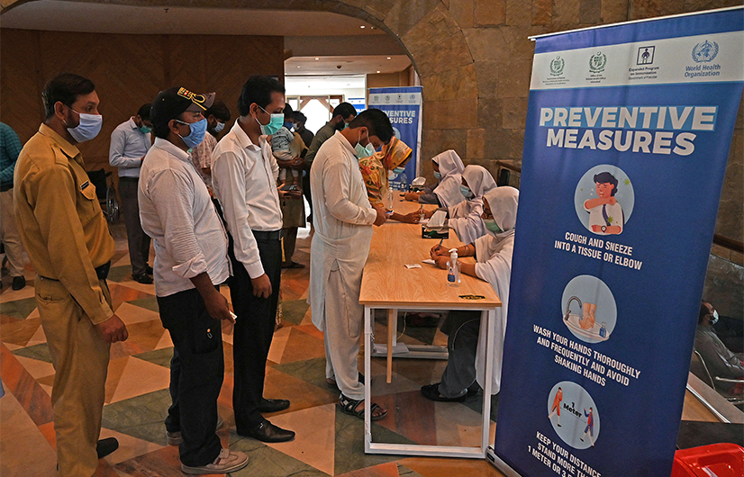 People register to get a dose of the Covid-19 coronavirus Sinovac vaccine at a mass vaccination centre in Islamabad on June 3, 2021. (AFP)