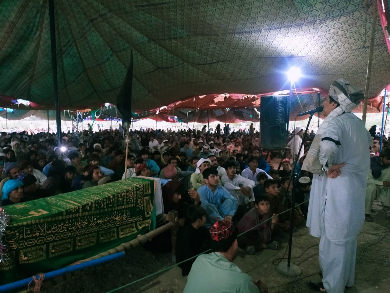 In this photo taken on June 17, 2021, tribesmen gather at a sit-in in Janikhel, a remote town in Khyber Pakhtunkhwa province, to protest the killing of one of its tribal elders. Going against their religious and tribal traditions, members of the Pashtun clan have not buried their slain leader since his assassination about 20 days ago. (Photo courtesy: Latif Wazir)