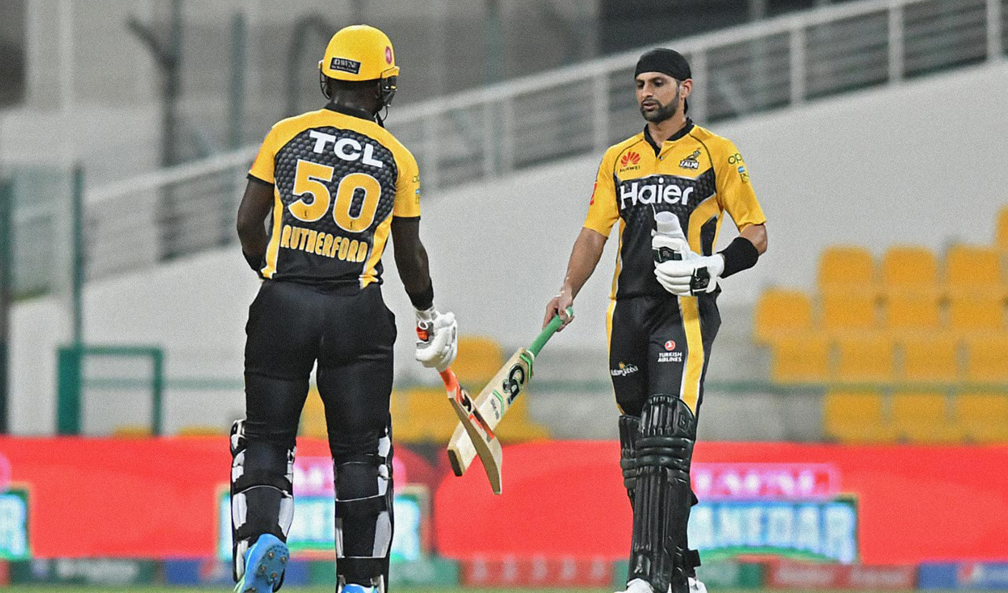 Peshawar Zalmi's Sherfane Rutherford, left, and Shoaib Malik during a Pakistan Super League match against Islamabad United in Abu Dhabi in June 17, 2021. (Photo courtesy: @thePSLt20/Twitter)