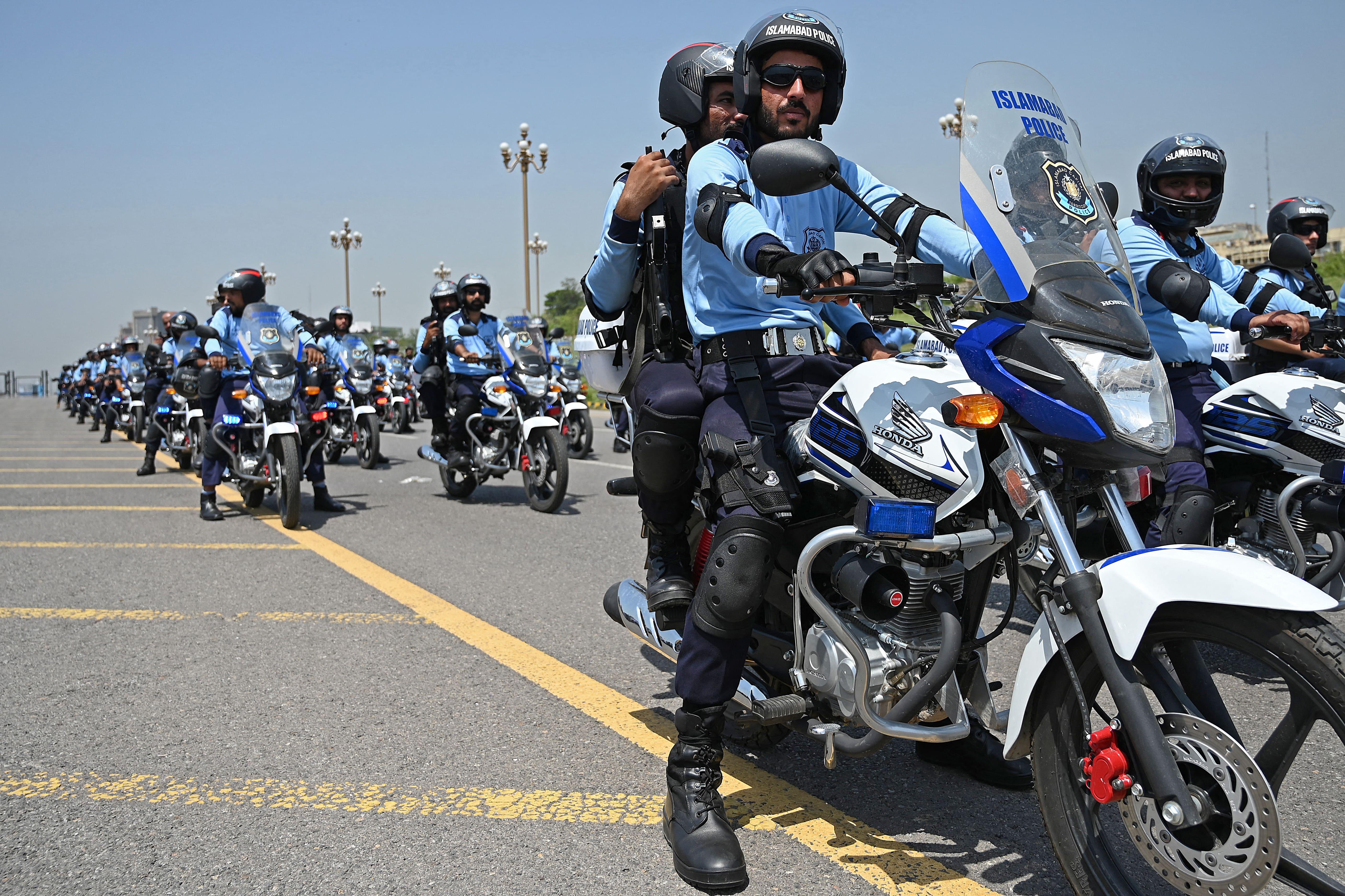 Police personnel from the newly formed 'Eagle Squad Unit' start patrolling the streets during a ceremony in Islamabad on June 18, 2021. (AFP)