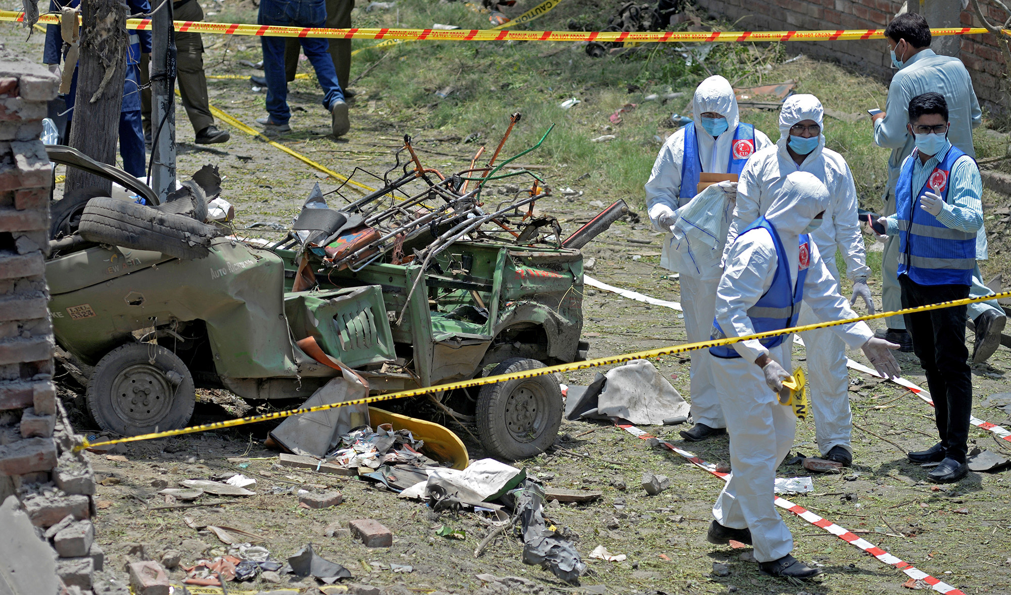 Members of the Counter Terrorism Department (CTD) survey the site after a deadly blast in residential area in Lahore on June 23, 2021. (REUTERS)