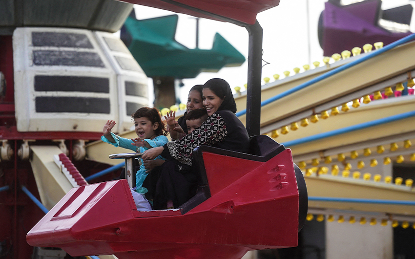 People enjoy a funfair ride after the government eased restrictions to curb the spread of Covid-19 restrictions in Karachi, Pakistan, on June 15, 2021. (AFP)