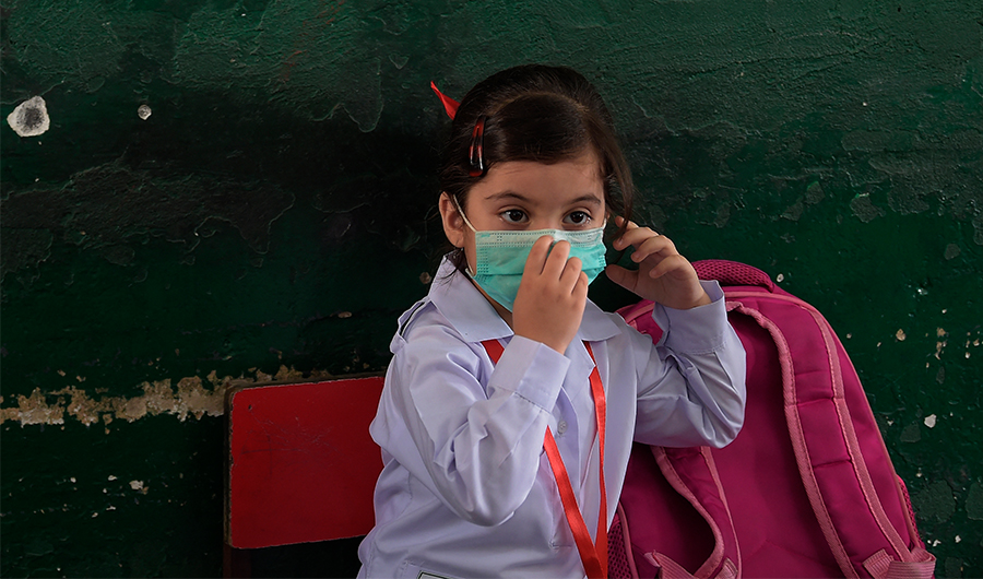A student attends a class at a school in Rawalpindi on June 7, 2021. (AFP)