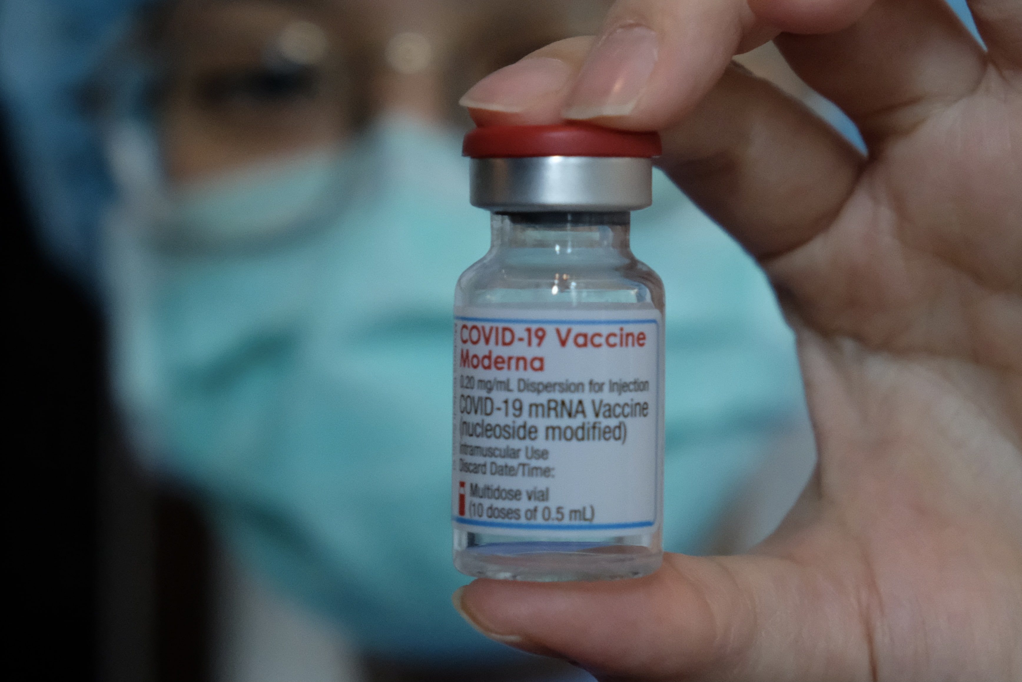A medical worker displays a Moderna vaccine gainst the Covid-19 coronavirus at Taipei Tzu Chi Hospital in New Taipei City on June 9, 2021. (AFP)