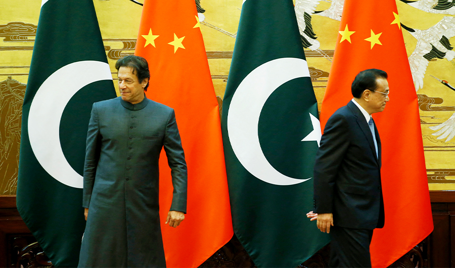 Pakistani Prime Minister Imran Khan (L) and China's Premier Li Keqiang leave after a signing ceremony at the Great Hall of the People in Beijing on November 3, 2018. (AFP/File)