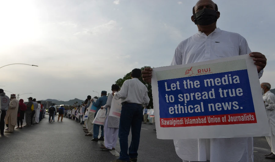 Journalists stand maintaining social distancing in a demonstration to mark the World Press Freedom Day during a government-imposed nationwide lockdown as a preventive measure against the COVID-19 coronavirus, in Islamabad on May 3, 2020. (AFP/ FILE)