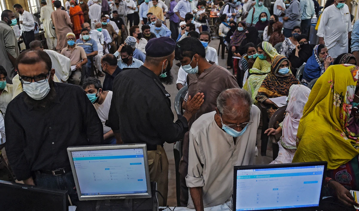 People register to receive a dose of the Covid-19 coronavirus Sinopharm vaccine at a vaccination camp in Karachi, Pakistan, on May 25, 2021. (AFP/File)