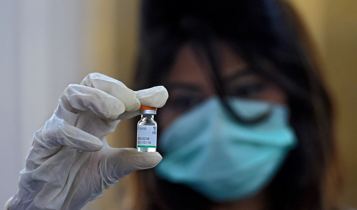 A doctor holds a vial of Chinese-made Sinopharm Covid-19 vaccine, at a vaccination centre in Karachi on February 3, 2021. (AFP/File)