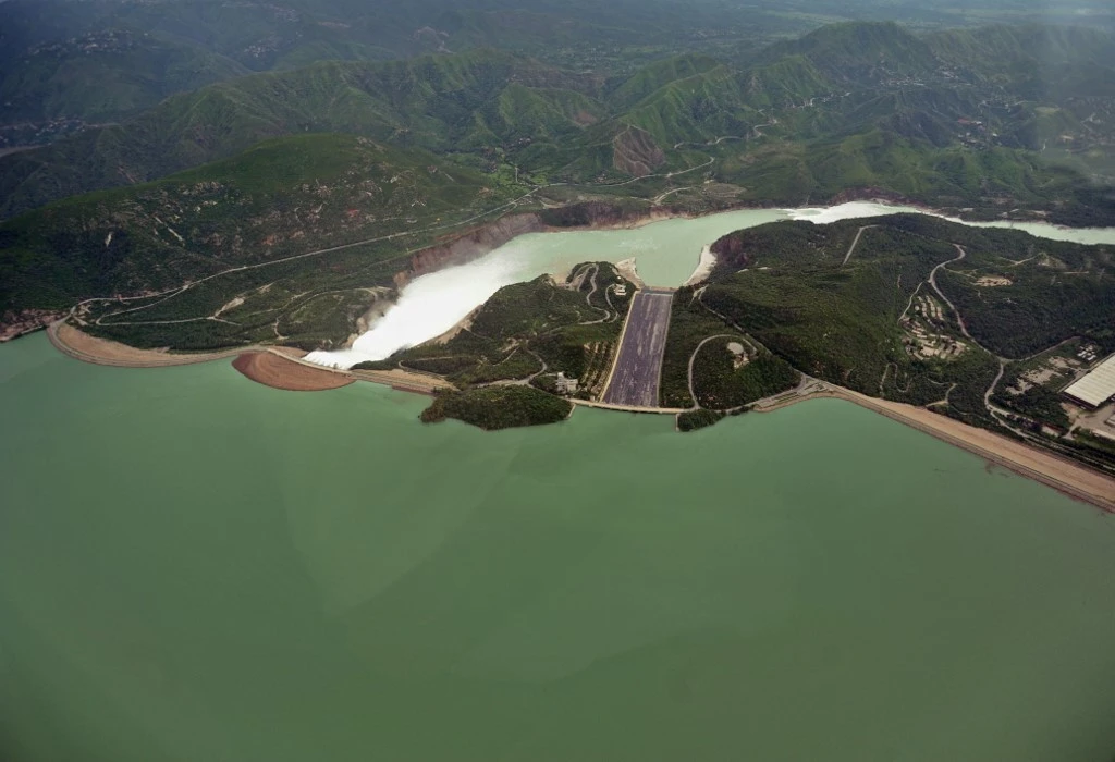 This aerial view shows water leaving the Tarbela Dam spillway in Tarbela, Khyber Pakhtunkhwa on August 24, 2010. (AFP/File)