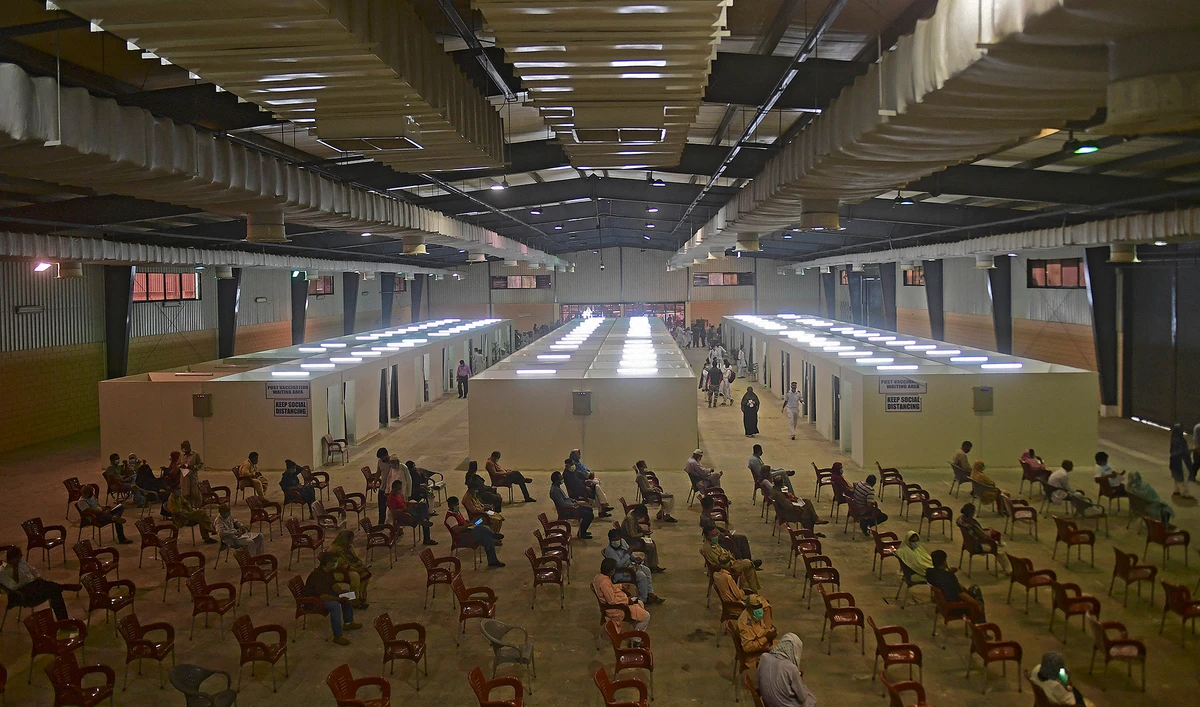 People wait to get inoculated with a dose of Covid-19 coronavirus vaccine at a vaccination centre in Karachi on May 12, 2021. (AFP/File)