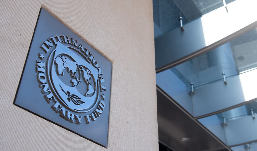 In this file photo taken on April 15, 2020 a sign is seen outside the headquarters of the International Monetary Fund (IMF) in Washington, DC. (AFP)