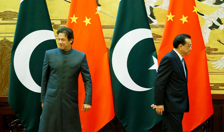 Pakistani Prime Minister Imran Khan (L) and China's Premier Li Keqiang leave after a signing ceremony at the Great Hall of the People in Beijing on November 3, 2018. (AFP/File)