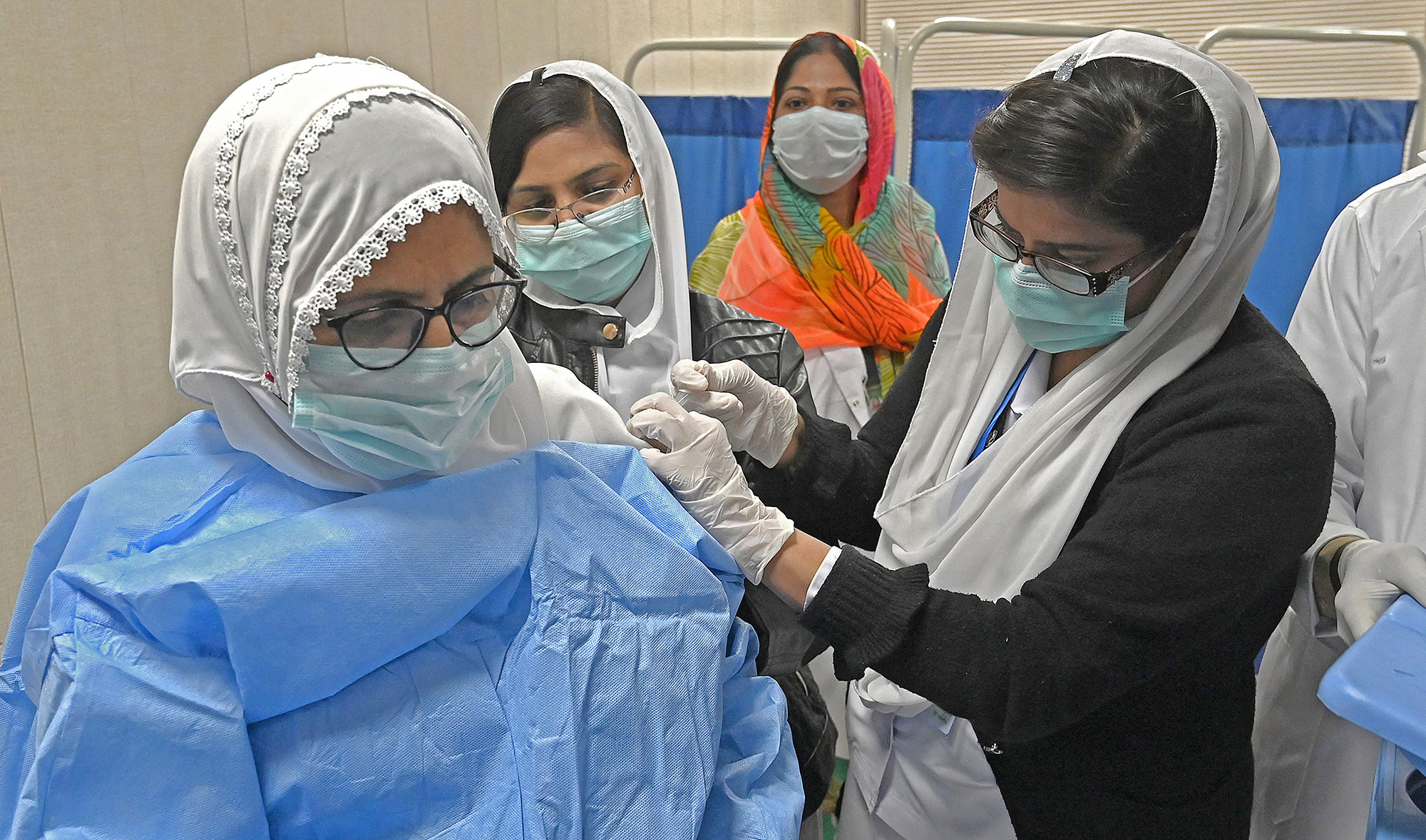 A doctor receives a dose of the Chinese-made Sinopharm Covid-19 vaccine, at a vaccination centre in Lahore on February 3, 2021. (AFP/File)