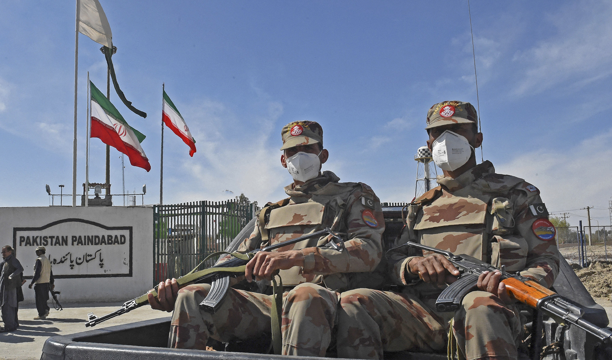 Pakistani soldiers wearing facemasks patrol near the closed Pakistan-Iran border in Taftan on February 25, 2020 as fears over the spread of the COVID-19 coronavirus escalated following an outbreak in neighboring Iran. (AFP/File)