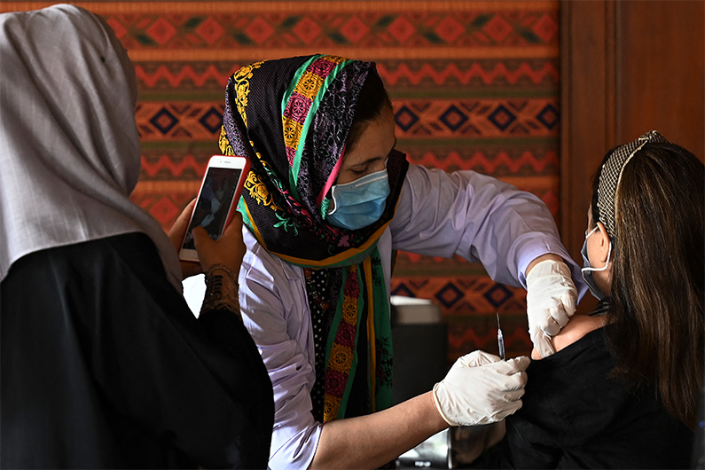 A woman receives a dose of the Covid-19 coronavirus vaccine at a vaccination camp in Islamabad on June 2, 2021. (AFP)