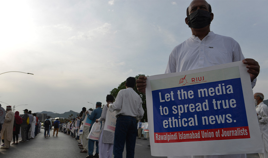 Journalists stand in a demonstration to mark the World Press Freedom Day in Islamabad on May 3, 2020. (AFP)