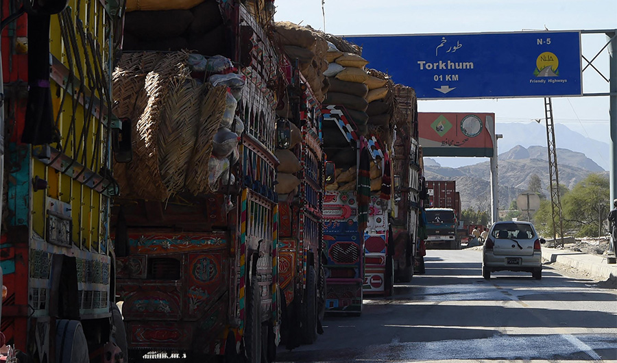Laden Pakistani trucks are seen near Torkham, close to the Pakistan-Afghanistan border, on April 14, 2017. (AFP)