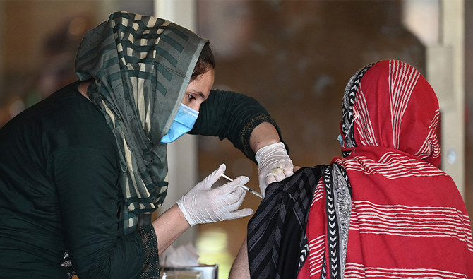 A woman receives the second dose of coronavirus Sinopharm vaccine at a vaccination camp in Islamabad, Pakistan, on May 20, 2021. (AFP)