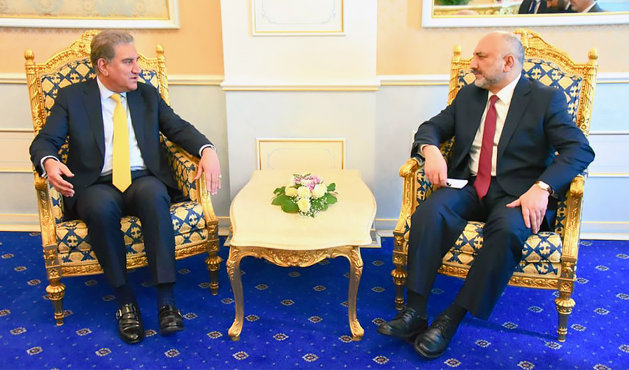 In this file photo, Pakistan's Foreign Minister, Shah Mahmood Qureshi (left), meets his Afghan counterpart, Haneef Atmar, on the sidelines of the 9th Ministerial Conference of the Heart of Asia in Dushanbe on March 30, 2021. (Photo courtesy: @SMQureshiPTI/Twitter)