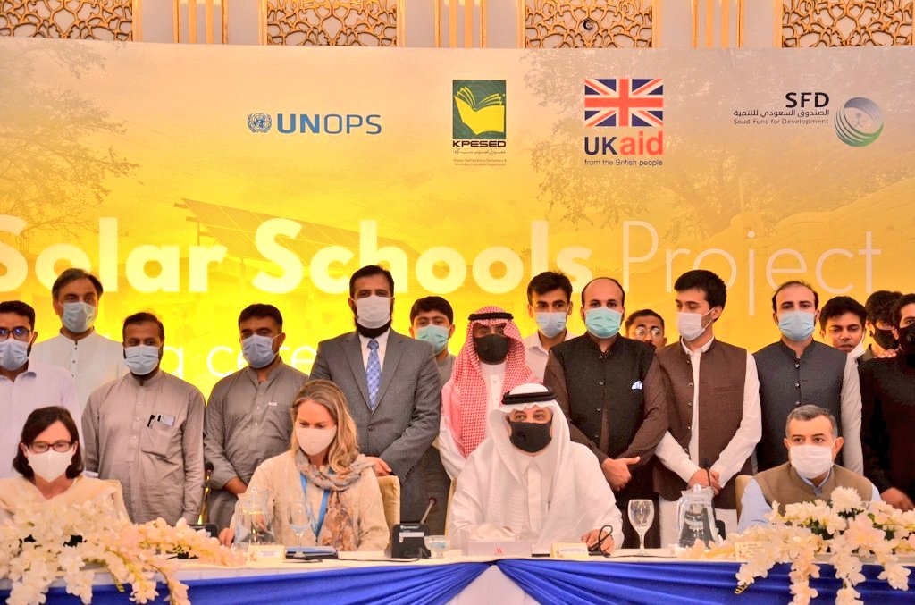 Saudi Arabia's ambassador to Pakistan Nawaf bin Said Al-Malki (sitting second from right) attends inauguration ceremony of Saudi solar energy project for Pakistani schools in Islamabad on July 13, 2021. (Photo courtesy: Saudi Embassy Pakistan)
